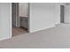 Neutral carpeted bedroom with ensuite bathroom and hallway entries at 543 Old Battle Bridge Rd, Wendell, NC 27591
