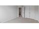 Spacious bedroom with open doorway and closet, featuring neutral carpet and walls at 543 Old Battle Bridge Rd, Wendell, NC 27591