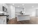 Modern kitchen with stainless steel appliances, granite countertops and kitchen island at 543 Old Battle Bridge Rd, Wendell, NC 27591