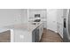 Stylish kitchen island with granite countertops and stainless steel appliances at 543 Old Battle Bridge Rd, Wendell, NC 27591