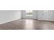 Bright and open living area featuring hardwood floors and a large window at 543 Old Battle Bridge Rd, Wendell, NC 27591