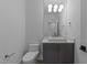 Chic powder room featuring modern vanity with vessel sink and decorative lighting at 861 Wimbleton Dr, Raleigh, NC 27609