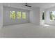 Large bedroom with multiple windows providing natural light, neutral carpet, and space for furnishings at 861 Wimbleton Dr, Raleigh, NC 27609