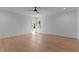 Bright bedroom featuring hardwood floors and dual windows, providing ample natural light at 861 Wimbleton Dr, Raleigh, NC 27609