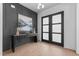 Elegant entryway featuring stylish console table, artwork, and modern double doors at 861 Wimbleton Dr, Raleigh, NC 27609