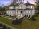 Stunning two-story home featuring stone accents, manicured lawn, and a grand entrance at 861 Wimbleton Dr, Raleigh, NC 27609