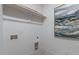Bright laundry room featuring shelving and modern decor, ready for appliances at 861 Wimbleton Dr, Raleigh, NC 27609