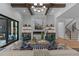 Stylish living room featuring a marble fireplace, accent seating, and large windows with great outdoor views at 861 Wimbleton Dr, Raleigh, NC 27609