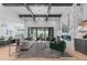 Open-concept living room with a marble fireplace, modern lighting, and seamless access to the outdoor pool area at 861 Wimbleton Dr, Raleigh, NC 27609