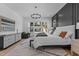 Bright main bedroom with a large bed, and windows offering a view of the landscaped backyard at 861 Wimbleton Dr, Raleigh, NC 27609
