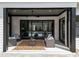 Covered patio with stylish furniture overlooking a pool and beautifully landscaped yard at 861 Wimbleton Dr, Raleigh, NC 27609