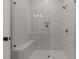 Elegant glass-enclosed shower with gray textured tiling and bronze hardware at 861 Wimbleton Dr, Raleigh, NC 27609