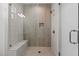 Contemporary shower with a bench, rain shower head, and decorative niche for storage at 861 Wimbleton Dr, Raleigh, NC 27609