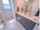 Bathroom featuring double sink vanity with modern fixtures and finishes with a shower and tile flooring at 457 Duncan Creek Rd # 141, Lillington, NC 27546