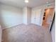Neutral bedroom with carpet, double door closet, and natural light at 457 Duncan Creek Rd # 141, Lillington, NC 27546