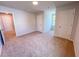 This bedroom has neutral walls and carpet, and access to two closets at 457 Duncan Creek Rd # 141, Lillington, NC 27546