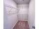 Walk-in closet featuring metal shelving and neutral carpet at 457 Duncan Creek Rd # 141, Lillington, NC 27546