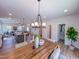 Open-concept dining area with modern lighting, contemporary decor, and seamless flow to the living spaces at 457 Duncan Creek Rd # 141, Lillington, NC 27546