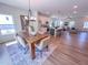 Open-concept living space features a large dining table, kitchen, and living room at 457 Duncan Creek Rd # 141, Lillington, NC 27546