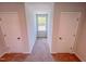 Neutral hallway with carpet, two closets, and a window at 457 Duncan Creek Rd # 141, Lillington, NC 27546