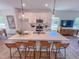 Open kitchen with island, bar seating, stainless appliances and pendant lighting at 457 Duncan Creek Rd # 141, Lillington, NC 27546