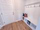This mud room features built-in shelving, coat hooks, and decorative pillows at 457 Duncan Creek Rd # 141, Lillington, NC 27546