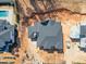 Aerial view showcases the home's dark roof, in-ground pool, and surrounding red clay landscape at 865 Wimbleton Dr, Raleigh, NC 27609