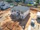 Aerial view of a two-story home under construction showcasing visible framing with surrounding residential neighborhood at 865 Wimbleton Dr, Raleigh, NC 27609