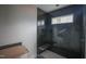 Modern bathroom features a black tiled shower with a built-in bench and a small window at 865 Wimbleton Dr, Raleigh, NC 27609
