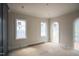 Sunlit bedroom boasting unique arched windows that let in ample natural light at 865 Wimbleton Dr, Raleigh, NC 27609