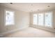 Bright bedroom with multiple windows, offering great natural light and outdoor views at 865 Wimbleton Dr, Raleigh, NC 27609