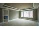 A primary bedroom with tray ceilings and a large window for plenty of natural light at 865 Wimbleton Dr, Raleigh, NC 27609