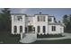 Elegant two-story white home featuring a symmetrical facade with large windows and manicured landscaping at 865 Wimbleton Dr, Raleigh, NC 27609