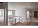 Unfinished foyer featuring an open staircase and light-filled spaces at 865 Wimbleton Dr, Raleigh, NC 27609