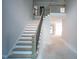Grand staircase ascending to the second floor with stylish black railing at 865 Wimbleton Dr, Raleigh, NC 27609