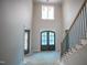 The bright foyer features a custom staircase and double doors to a yet-to-be-unveiled room at 865 Wimbleton Dr, Raleigh, NC 27609