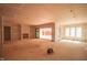 Unfinished living room area showcasing a fireplace, sliding glass doors, and ample natural light at 865 Wimbleton Dr, Raleigh, NC 27609