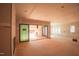 Unfinished living room with fireplace, sliding glass doors, and multiple windows with natural light at 865 Wimbleton Dr, Raleigh, NC 27609