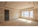 Spacious, unfinished room with modern ceiling details and large windows at 865 Wimbleton Dr, Raleigh, NC 27609