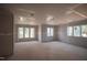 Large, unfinished room with multiple windows, awaiting customization at 865 Wimbleton Dr, Raleigh, NC 27609