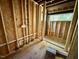 Framed bathroom showcasing exposed beams, plumbing, and natural light at 708 Catawba St, Raleigh, NC 27609