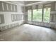 Unfinished bedroom with large windows offering scenic outdoor views at 708 Catawba St, Raleigh, NC 27609
