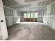 Spacious unfinished room with multiple windows and wiring for fixtures at 708 Catawba St, Raleigh, NC 27609