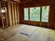 Framed Primary bedroom showcasing exposed beams, flooring, and natural light at 708 Catawba St, Raleigh, NC 27609