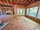 Framed dining room showcasing exposed beams, flooring, and three large windows at 708 Catawba St, Raleigh, NC 27609