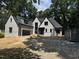 Newly constructed two-story home featuring a gray exterior, a black roof, and an attached two-car garage at 708 Catawba St, Raleigh, NC 27609