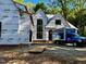 New home construction showing windows, building materials, and lumber delivery at 708 Catawba St, Raleigh, NC 27609