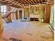 Framed living room with fireplace, stairs, flooring, and natural light at 708 Catawba St, Raleigh, NC 27609