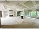 Bright, unfinished living room with recessed lighting and access to the outdoors at 708 Catawba St, Raleigh, NC 27609