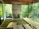 Framed screened porch showcasing fireplace, flooring, and natural light at 708 Catawba St, Raleigh, NC 27609